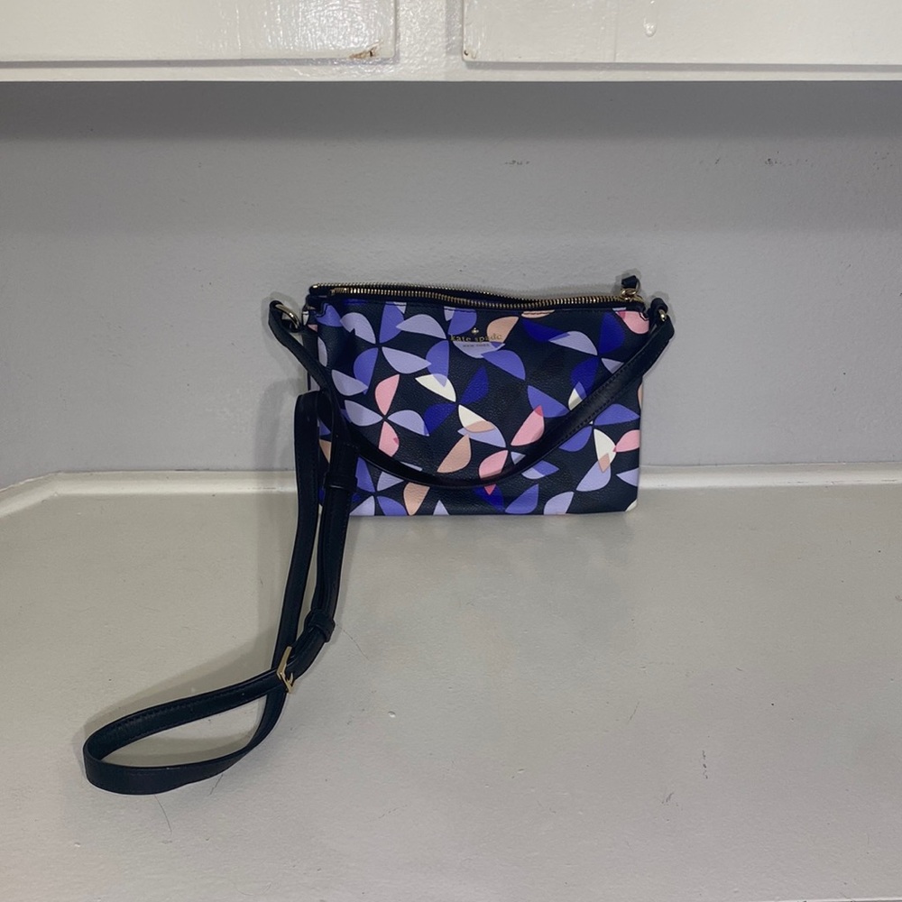 black floral crossbody kate spade messenger bag with adjustable strap